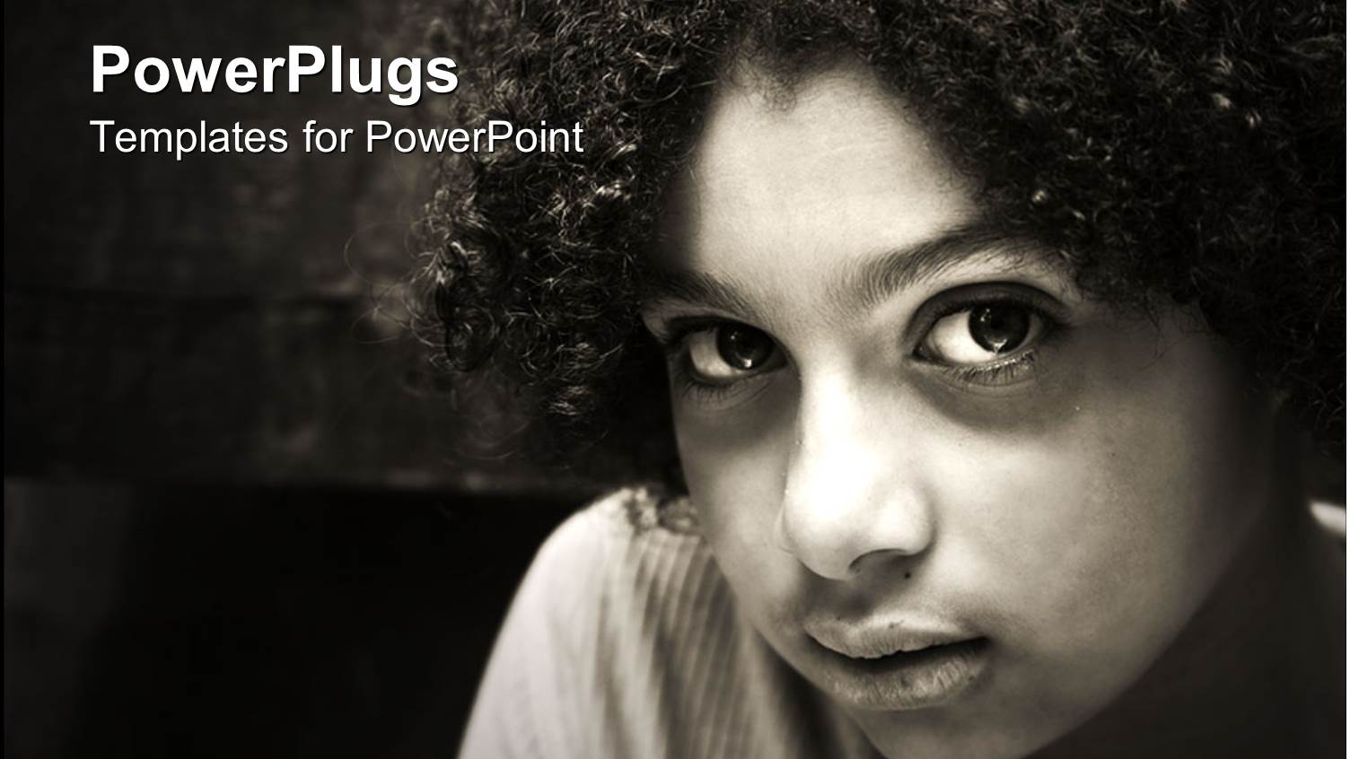 Black and White Close Up of Biracial Girl with Curly Hair and Sad Look in her Eyes