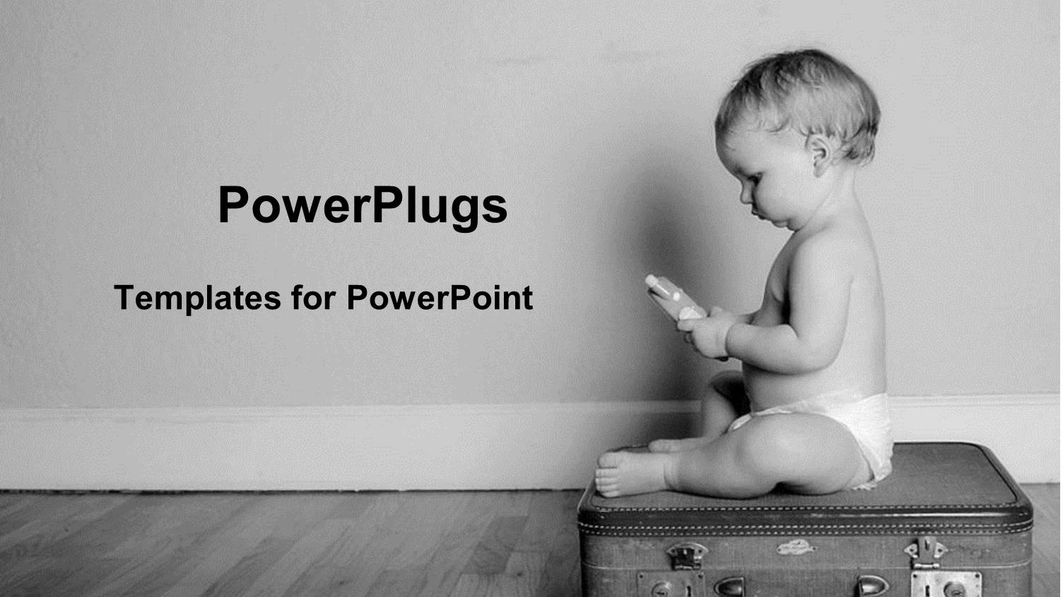 Black and White Representation of Baby Sitting on Top of Suitcase Holding Toy in Hands