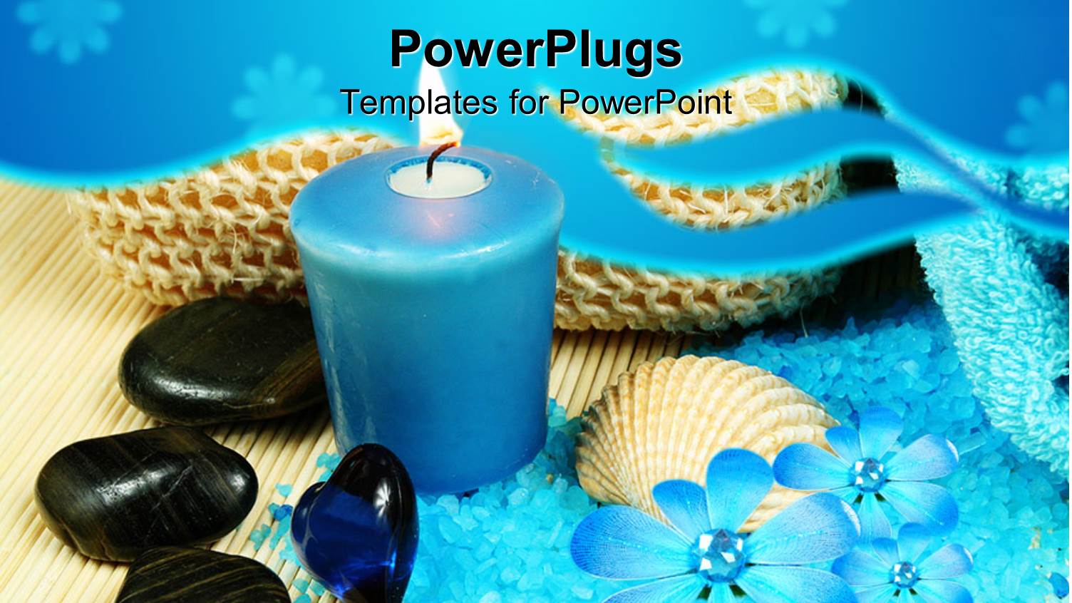 Blue Candle Next to Black Pebbles and Blue Bath Salts