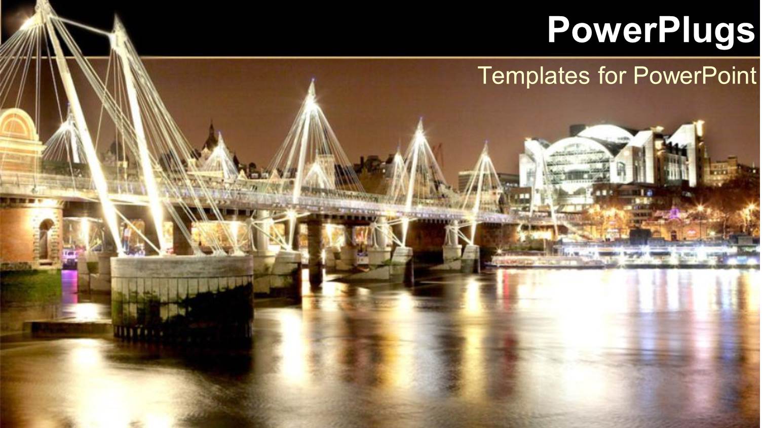 Brightly Lit London Bridge with Boats Underneath on a Lake