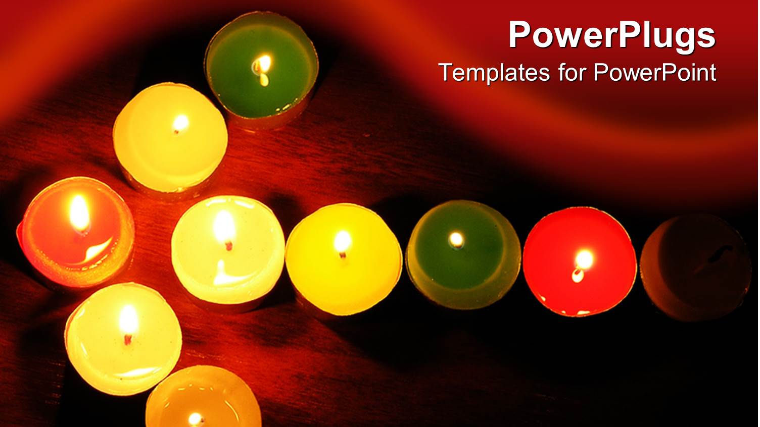 Burning Multicolored Votive Candles Arranged in Arrow on Dark Background