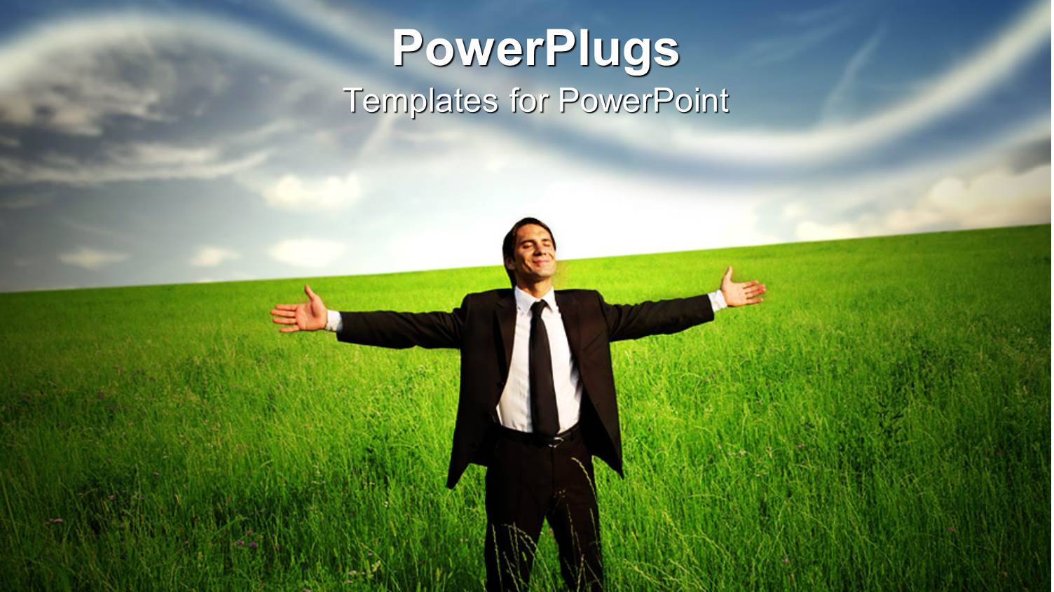 Business Man Standing in a Grass Field Looking Happy