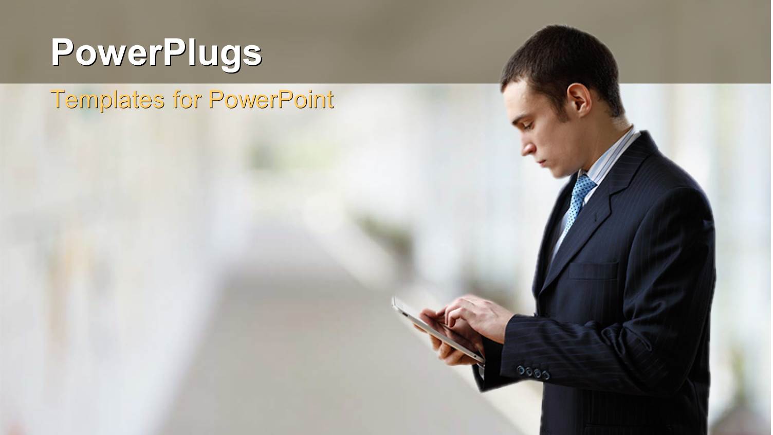 Businessman Operating Touch Screen PDA Device Over Blurry Background