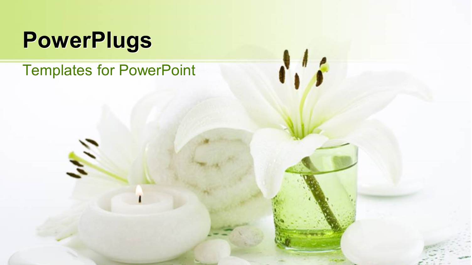 a Candle with a Towel and some Pebbles all in White