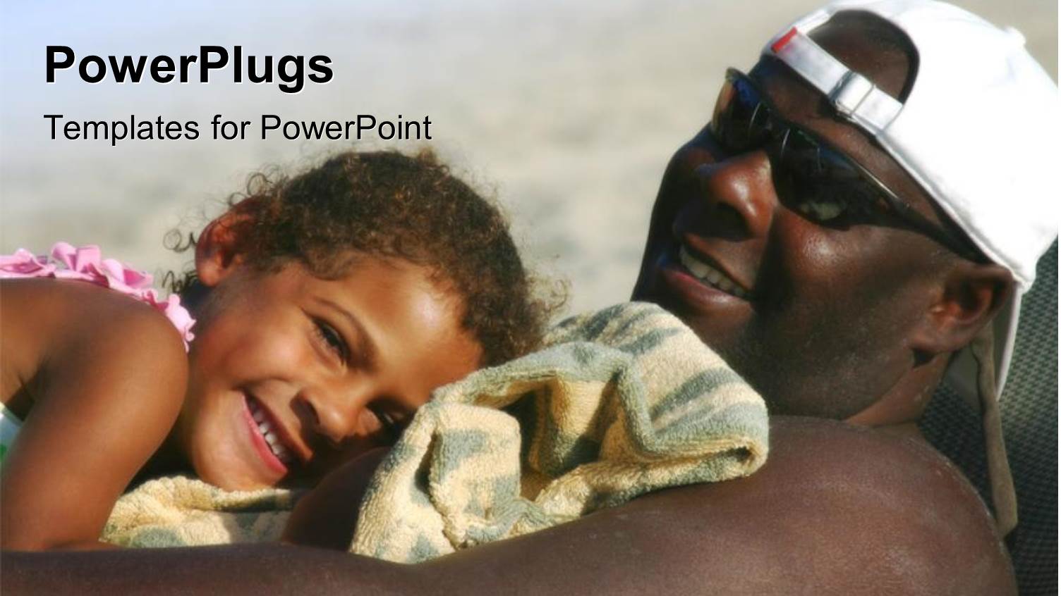 Close-up of African American Father Relaxing on Beach Chair with Daughter