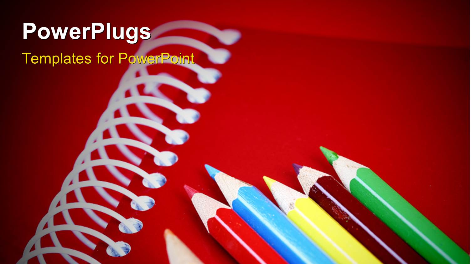 Close-up Depiction of Pencils on a Notebook with Red Color