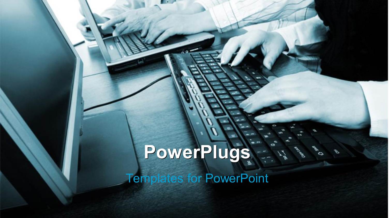 Close-up of Hand Operating Computer Keyboard with Monitor on Desk