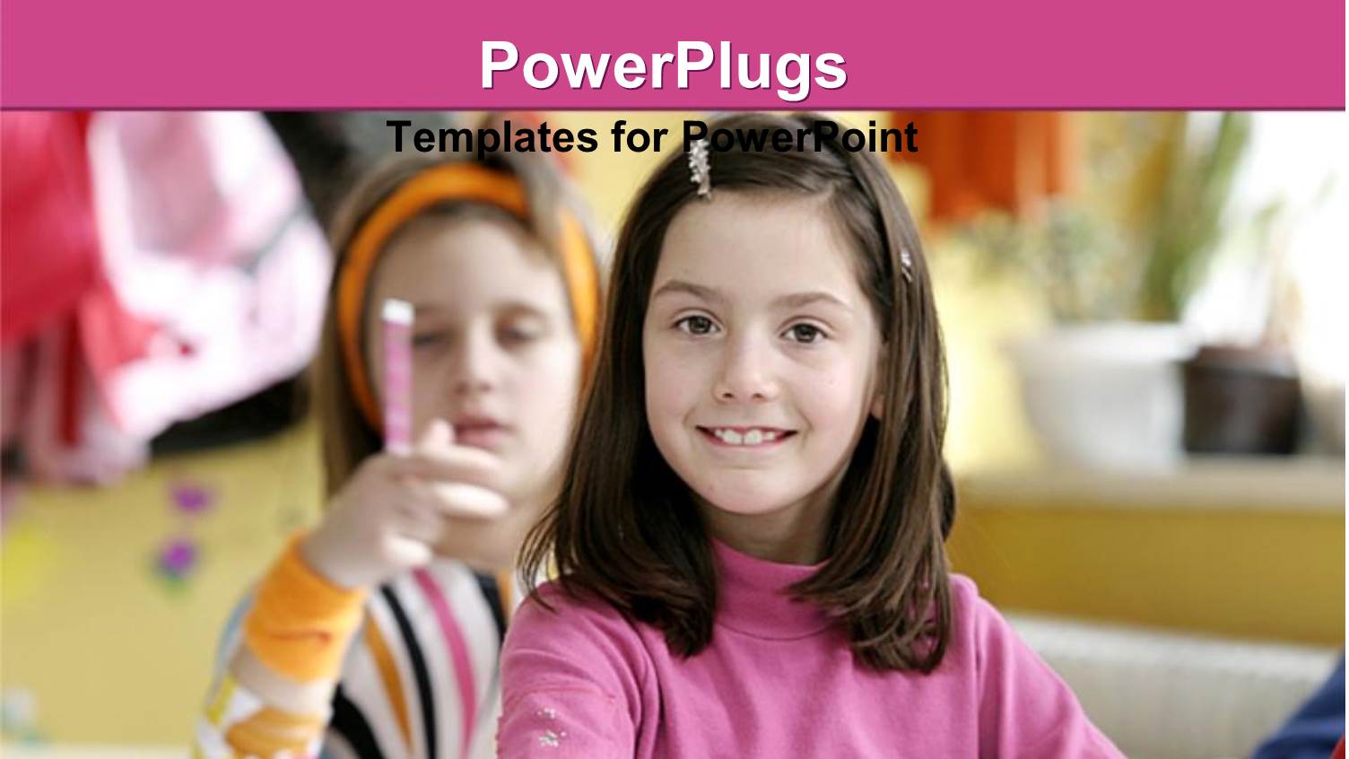 a Close Up View of a Young Girl Smiling in her Classroom