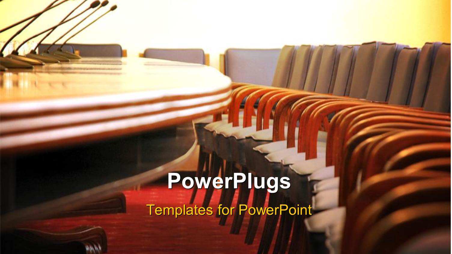 Conference Room with Microphones and Empty Wooden Chairs