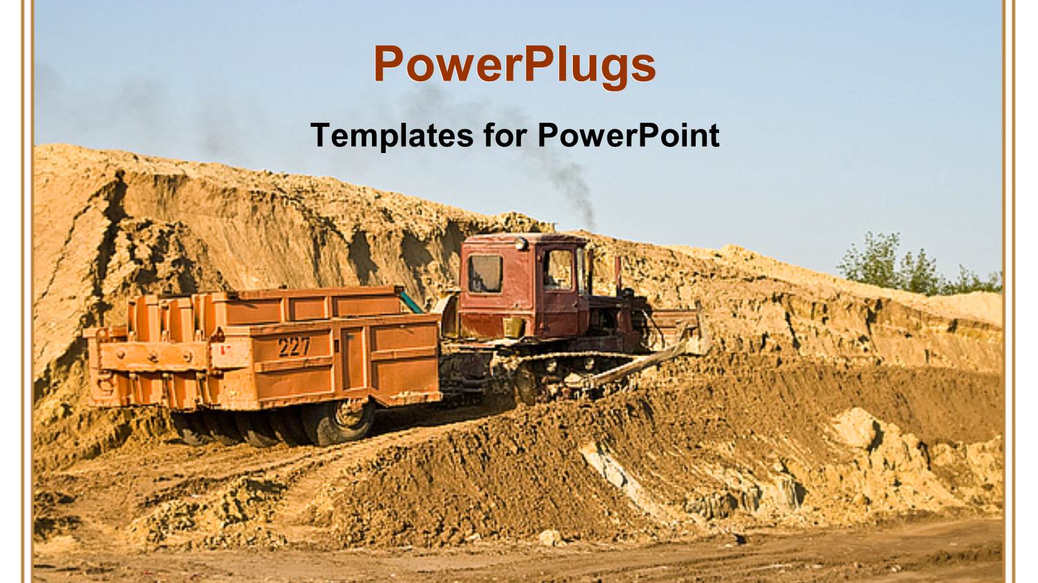 Construction Vehicle on a Hill of Dirt with Clear Blue Sky