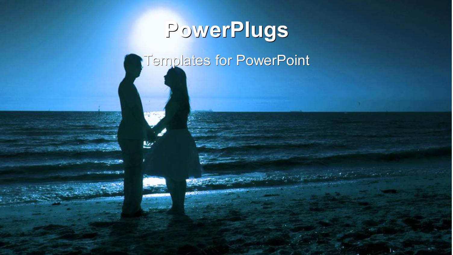 Couple Holding Hands Gazing into One Another's Eyes on Beach at Sunset