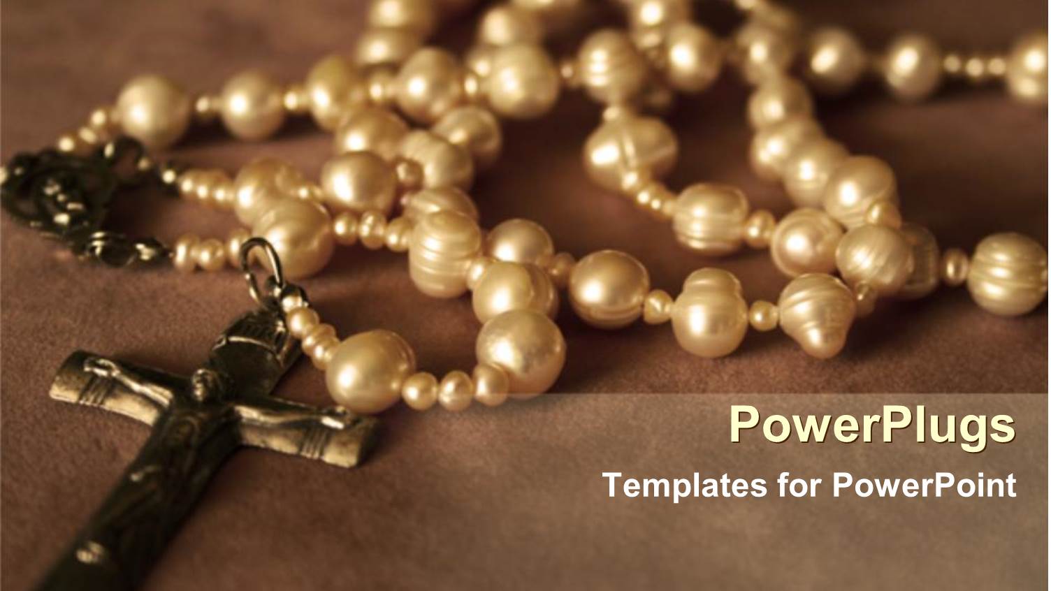 Cute Rosary Beads with Crucifix Laying on Brown Background