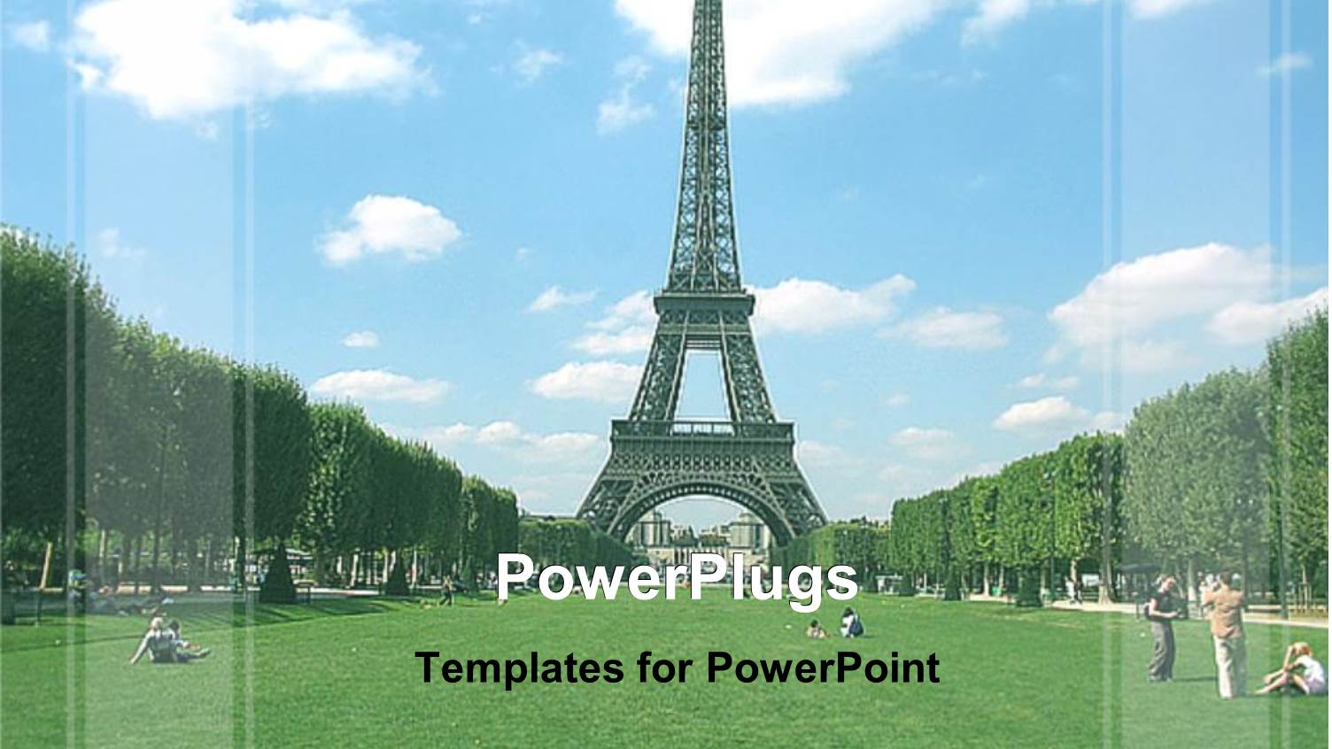 Day Time View of the Eiffel Tower Over Looking a Green Field