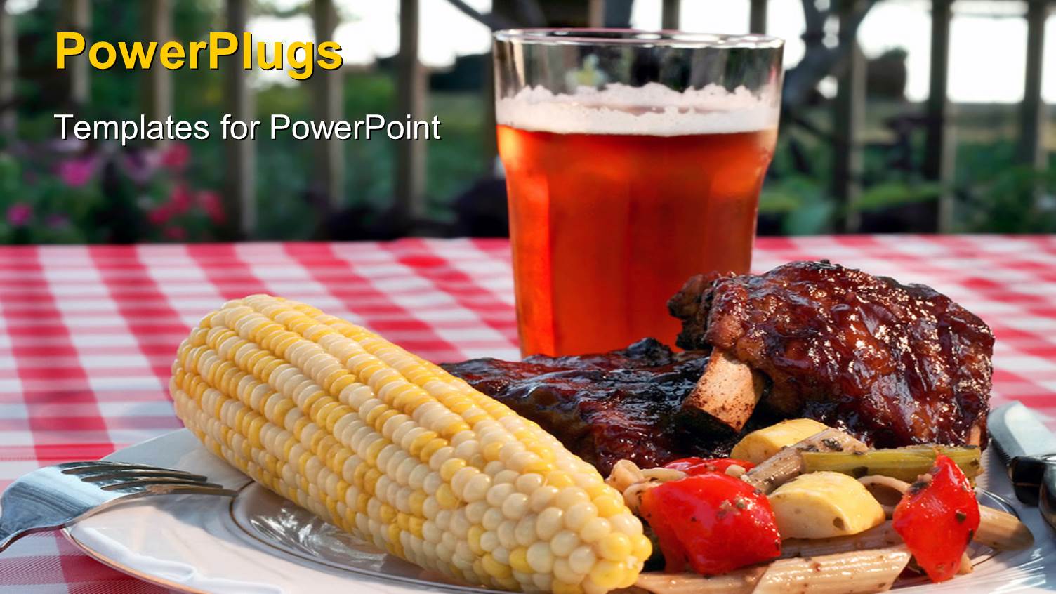 a Glass of Juice with a BBQ in Front