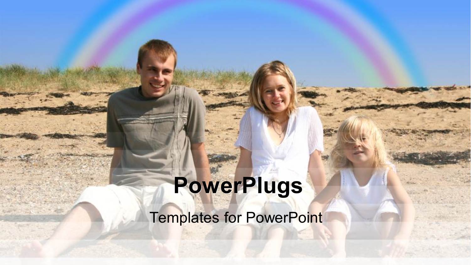 Family on Holiday at the Beach with Rainbow