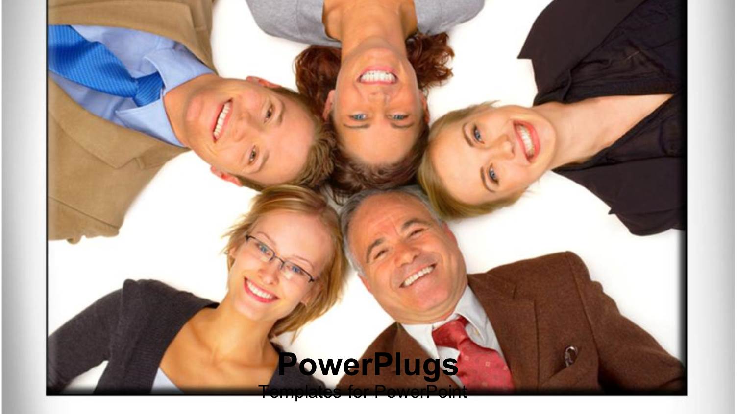 Five People Laying Down and Smiling with their Heads Together