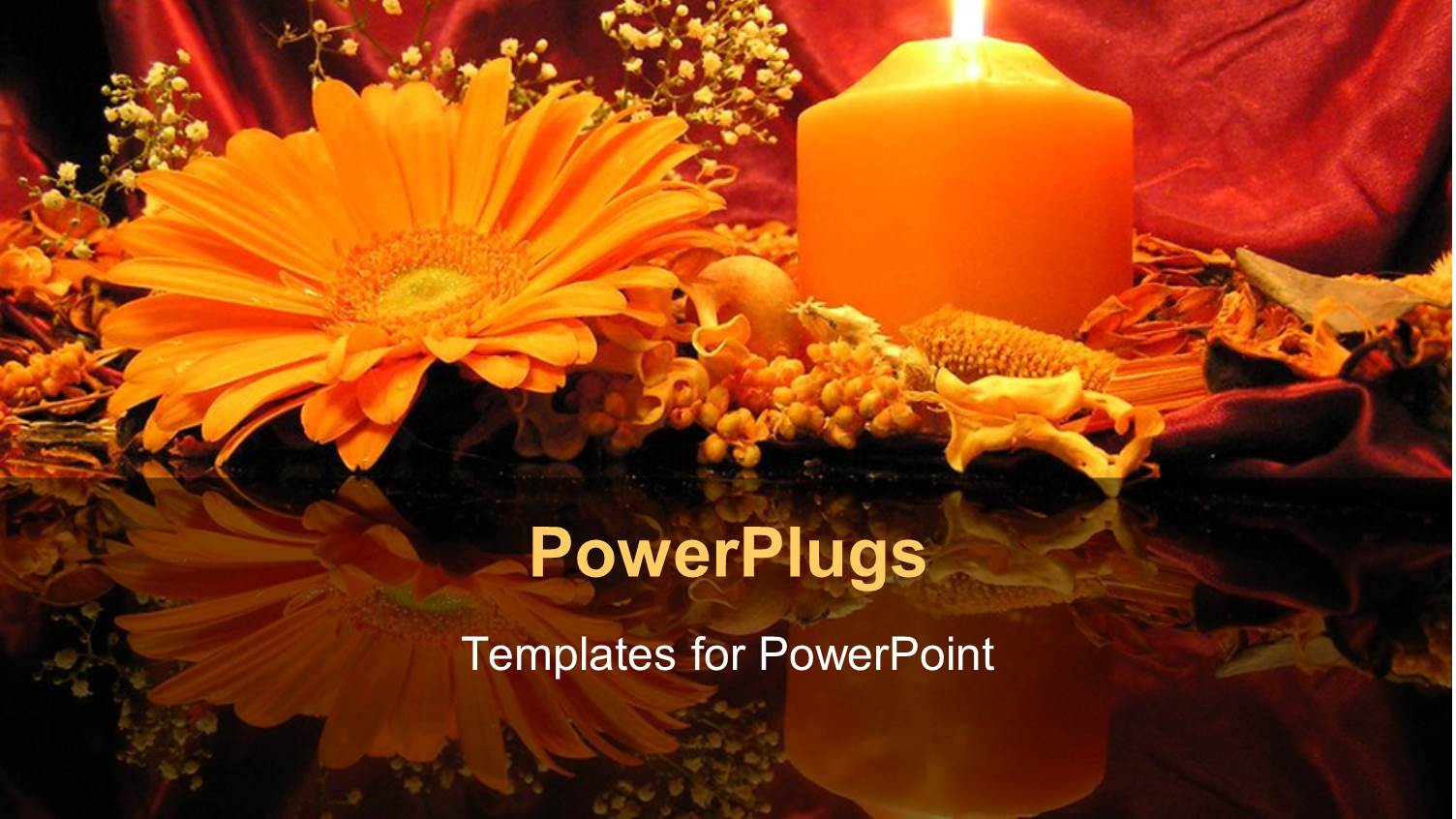 Flowers and Burning Pillar Candle on Reflective Table Top