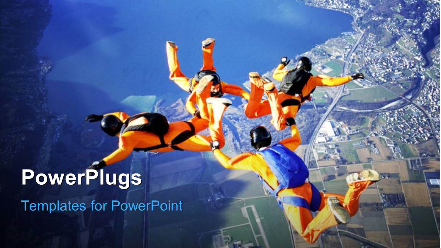 Four Skydivers Performing Stunt in Sky Over Modern City with Lakes and Mountains