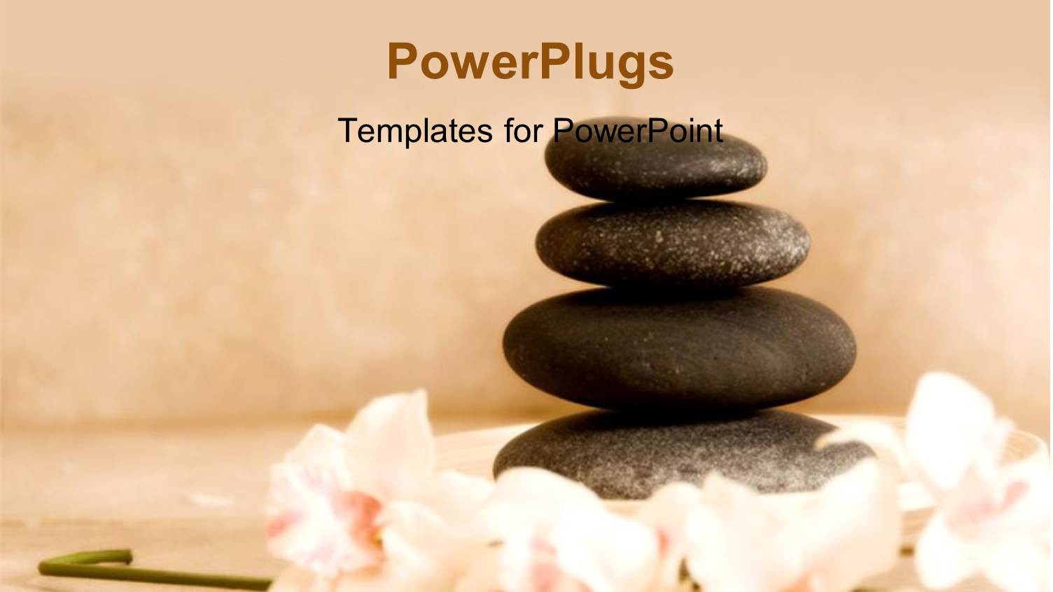 Four Spa Stones Arranged on Each other with some Flowers 