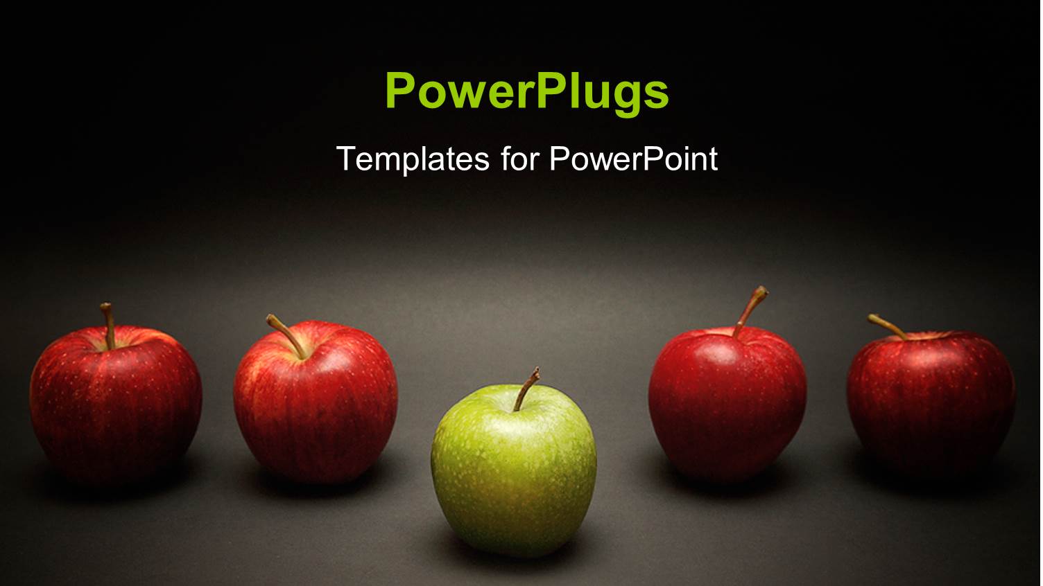 Green Apple Stands Out from Red Apples in Line Over Grey Background