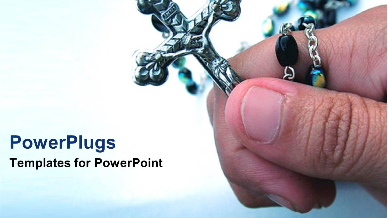 Hand Holding Crucifix on White and Blue Background 