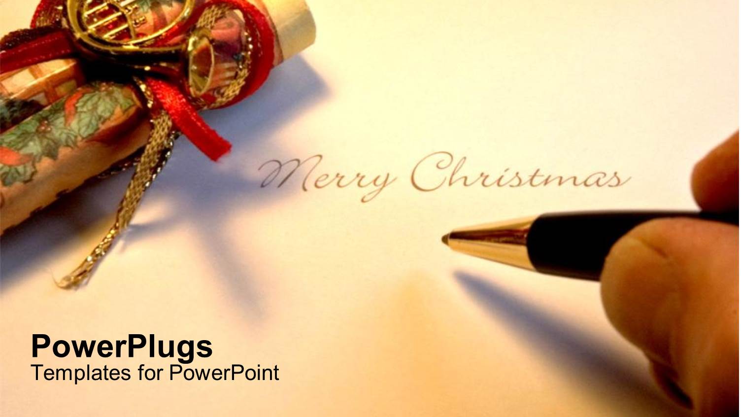 Hand Holding Pen Writing Merry Christmas