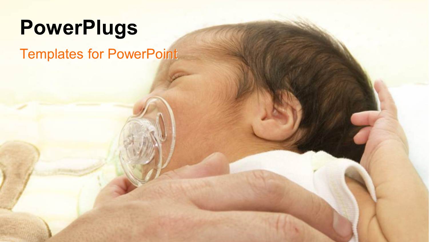 a Hand Holding a small Baby with a Sucker