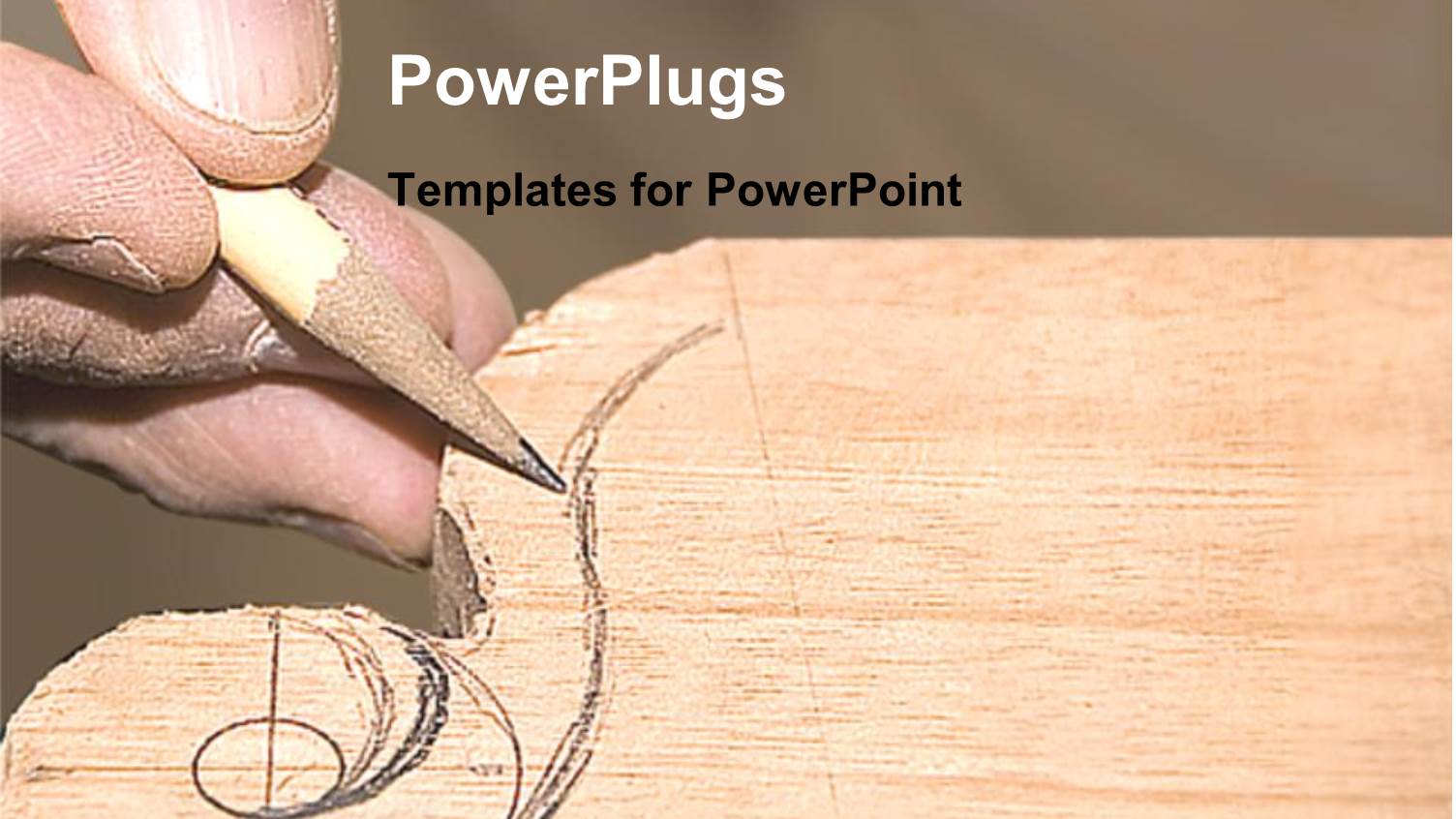 Hand with a Pencil Carving a Design on a Piece of Wood