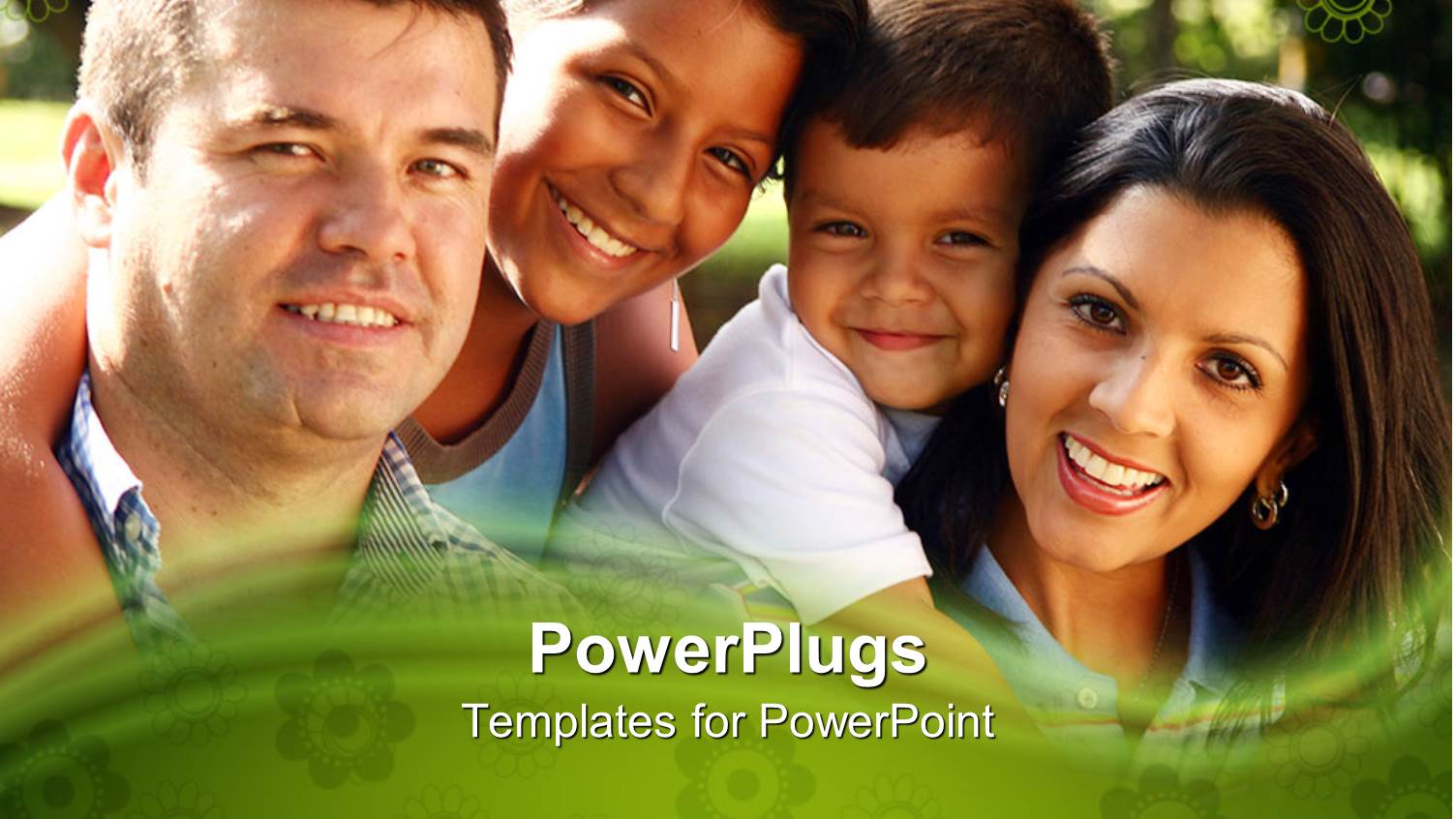 Happy Family of Four Smiling as they Pose for Snapshot in Park