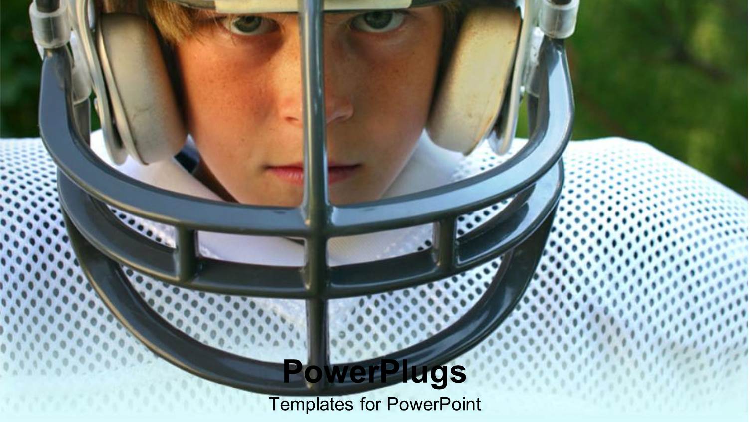 a Kid in Football Gear with Greenery in the Background