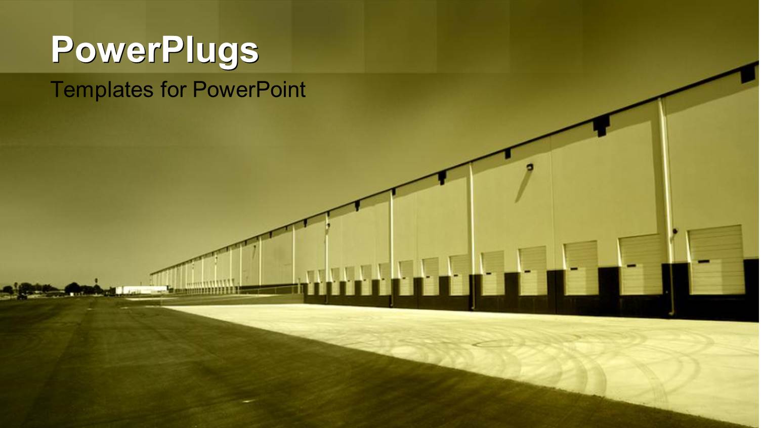 a large Open Field with a Wide Building on the Right