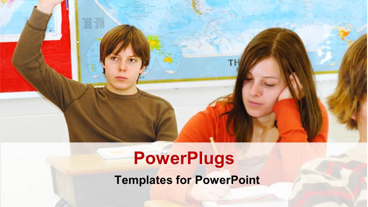 Lots of Students in a Class with a Boy Raising his Hands