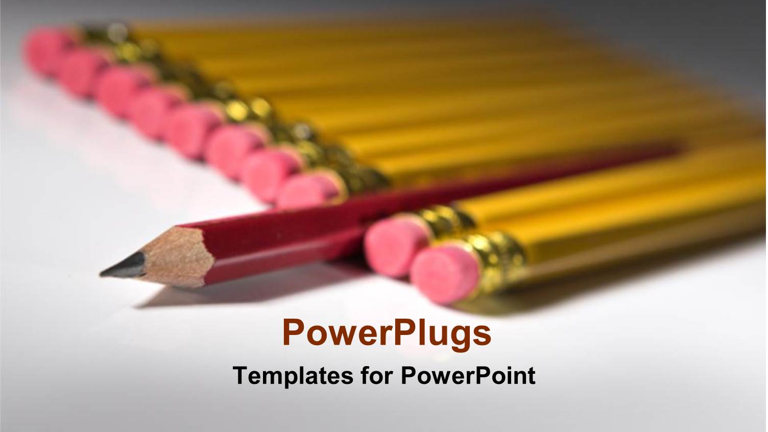 Lots of Yellow Pencils on a White Surface with a Distinct Red One