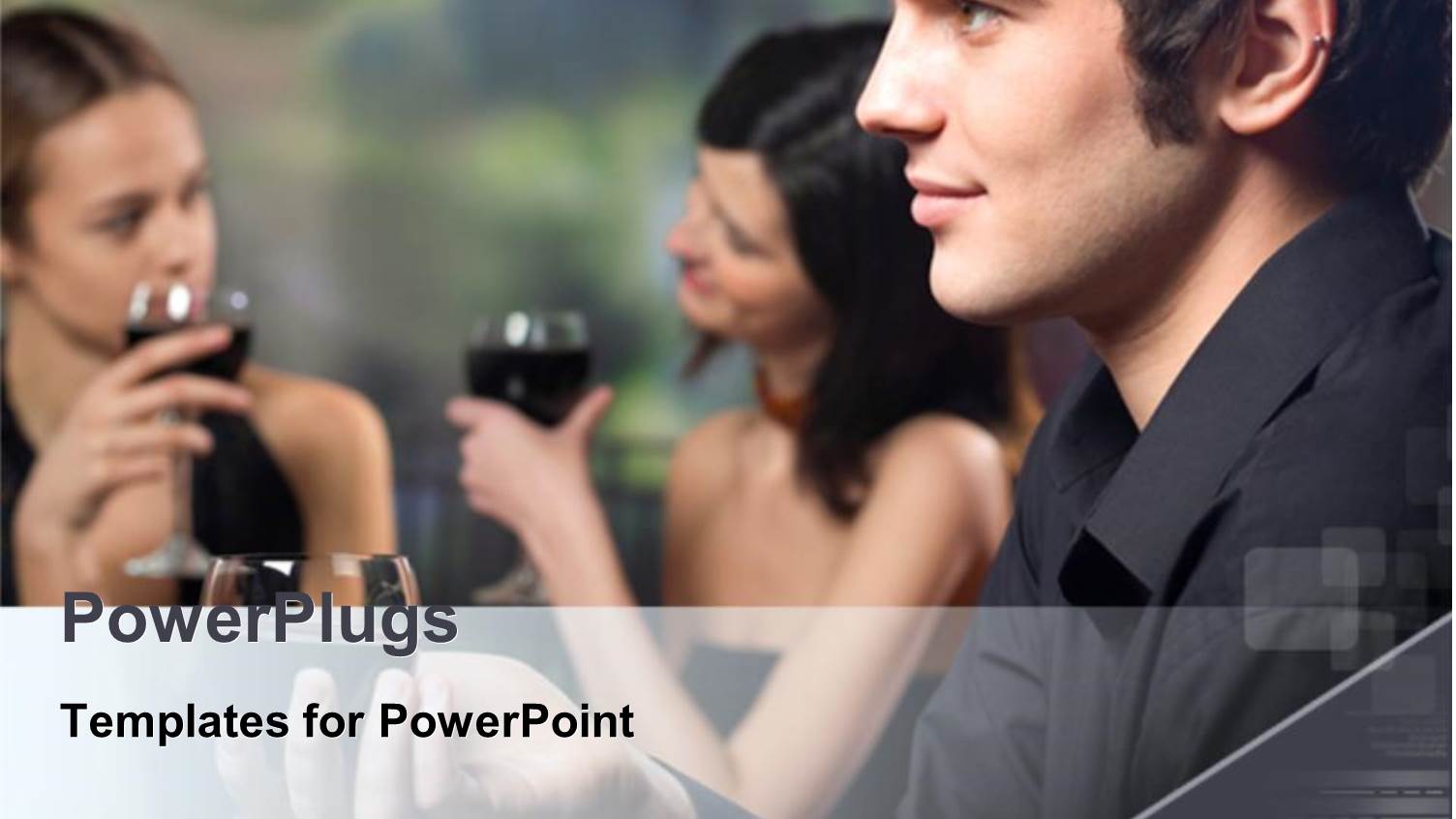 a Man Wearing Black Smiling with Two Ladies Having a Drink Behind