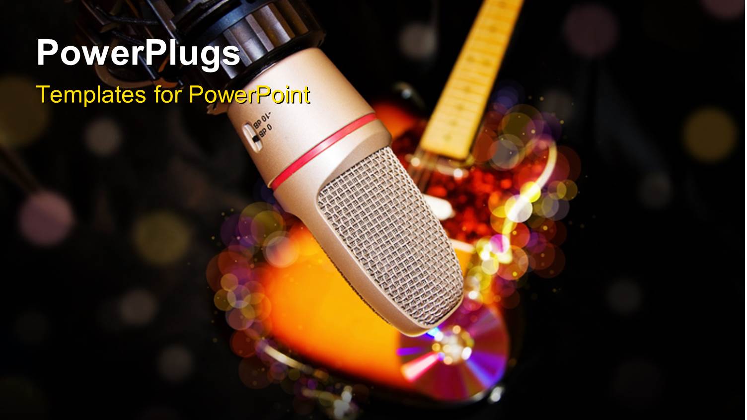 a Microphone with a Guitar and some Discs on the Background