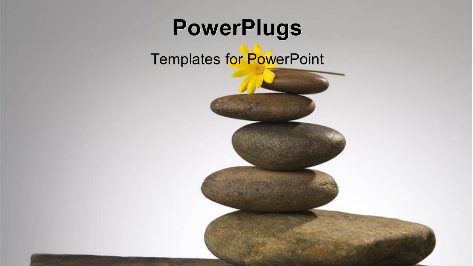 a Number of Zen Stones Witha  Flower and Grey Background