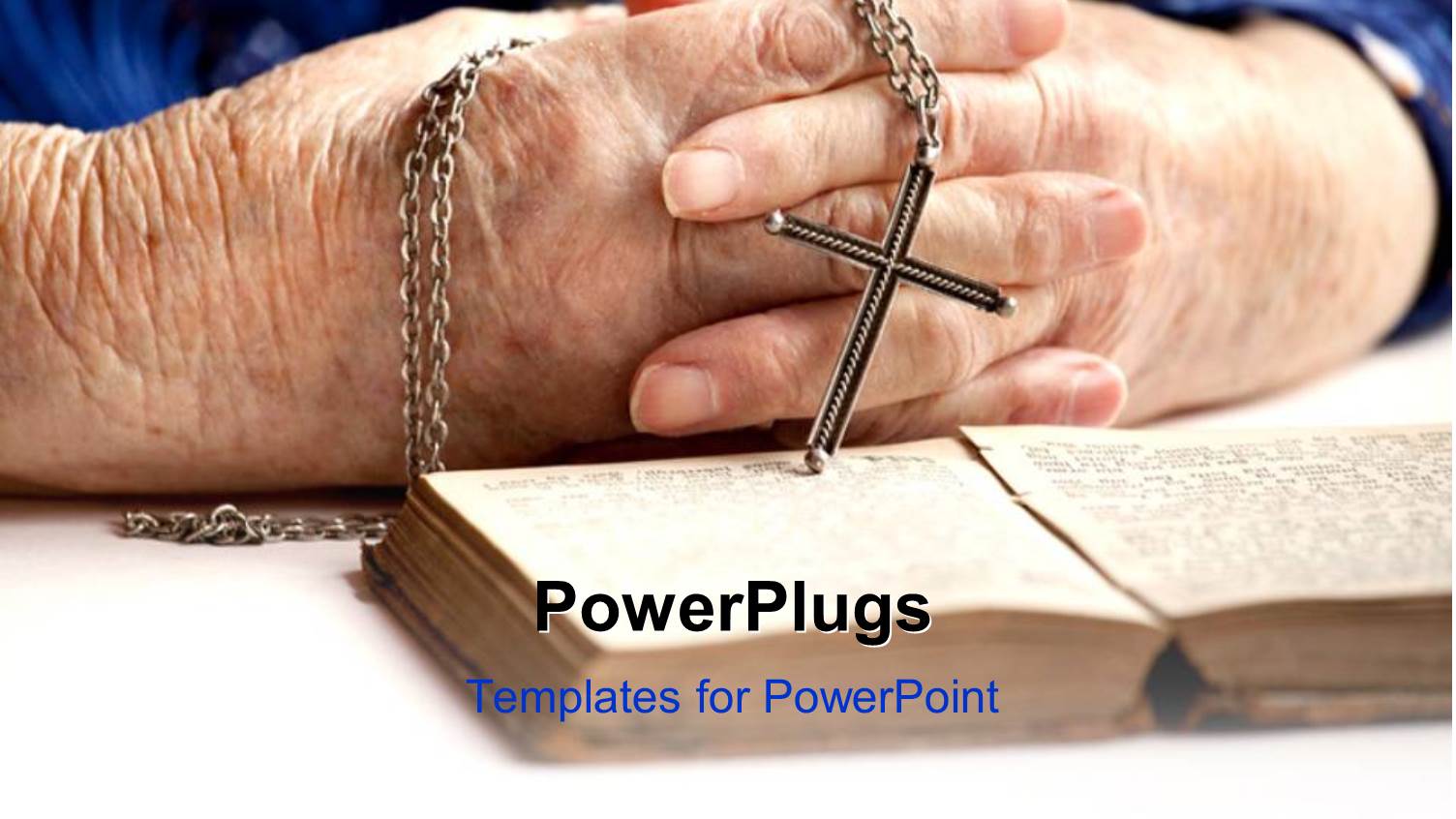 a Pair of Hands Holding a Rosary with an Open Book