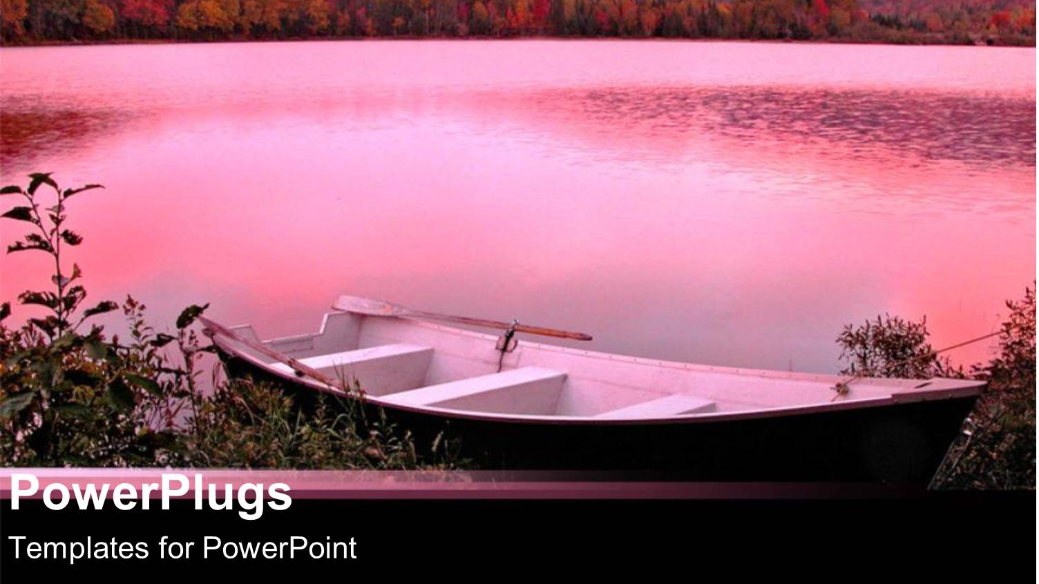 Pink Infused Backdrop of Lake with Canoe at Shore