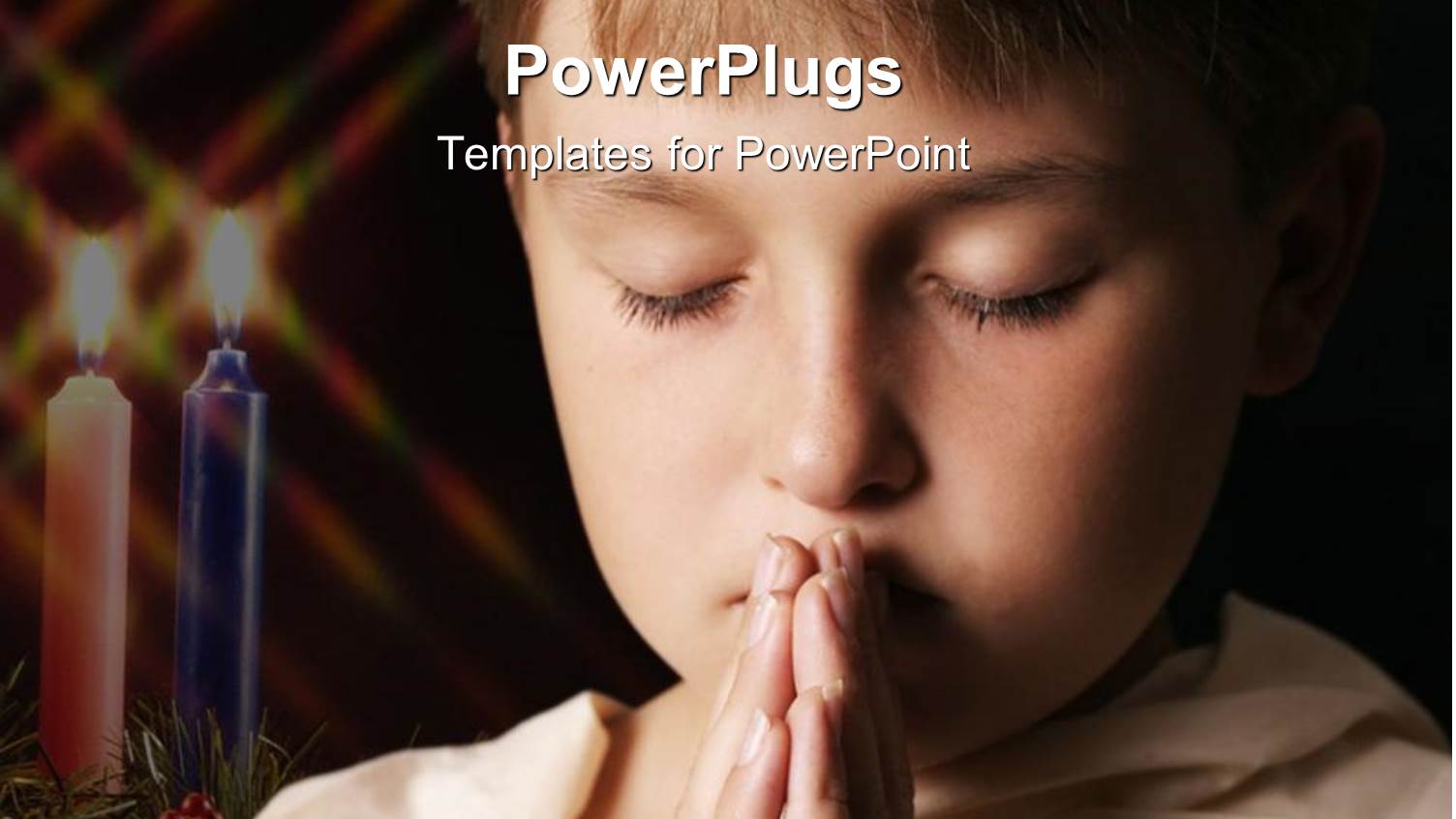 Praying Child with Eyes Closed Next to Two Burning Candles