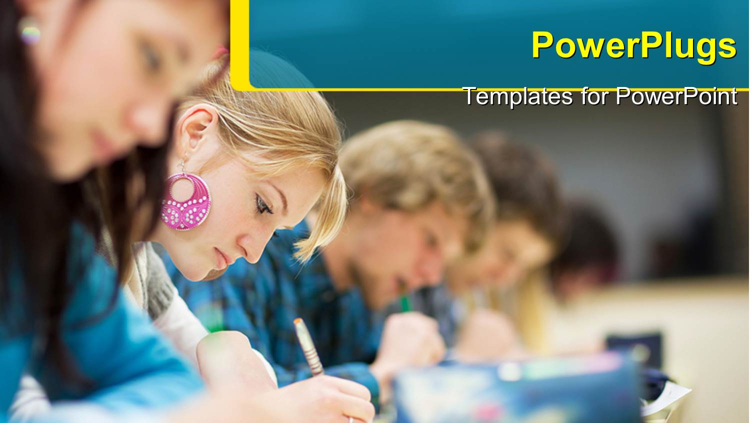 Pretty Female College Student Sitting an Exam in a Classroom Full of Students