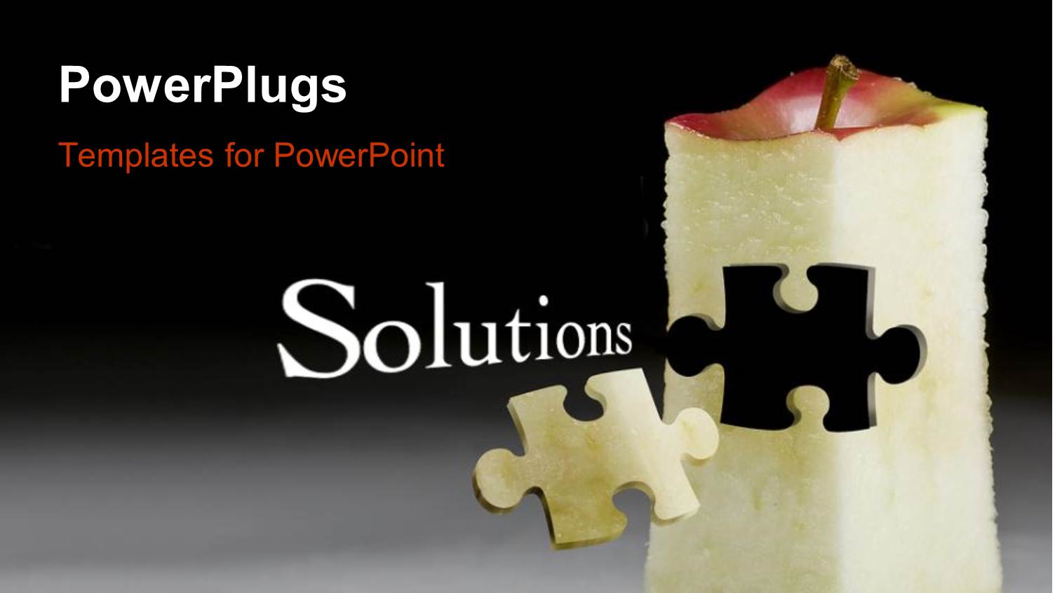 Puzzle Piece Carved Out of Red Apple on Grey Floor