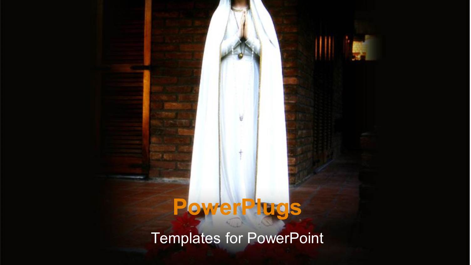 Religious Statue of Virgin Mary with Spotlight and Brick Wall