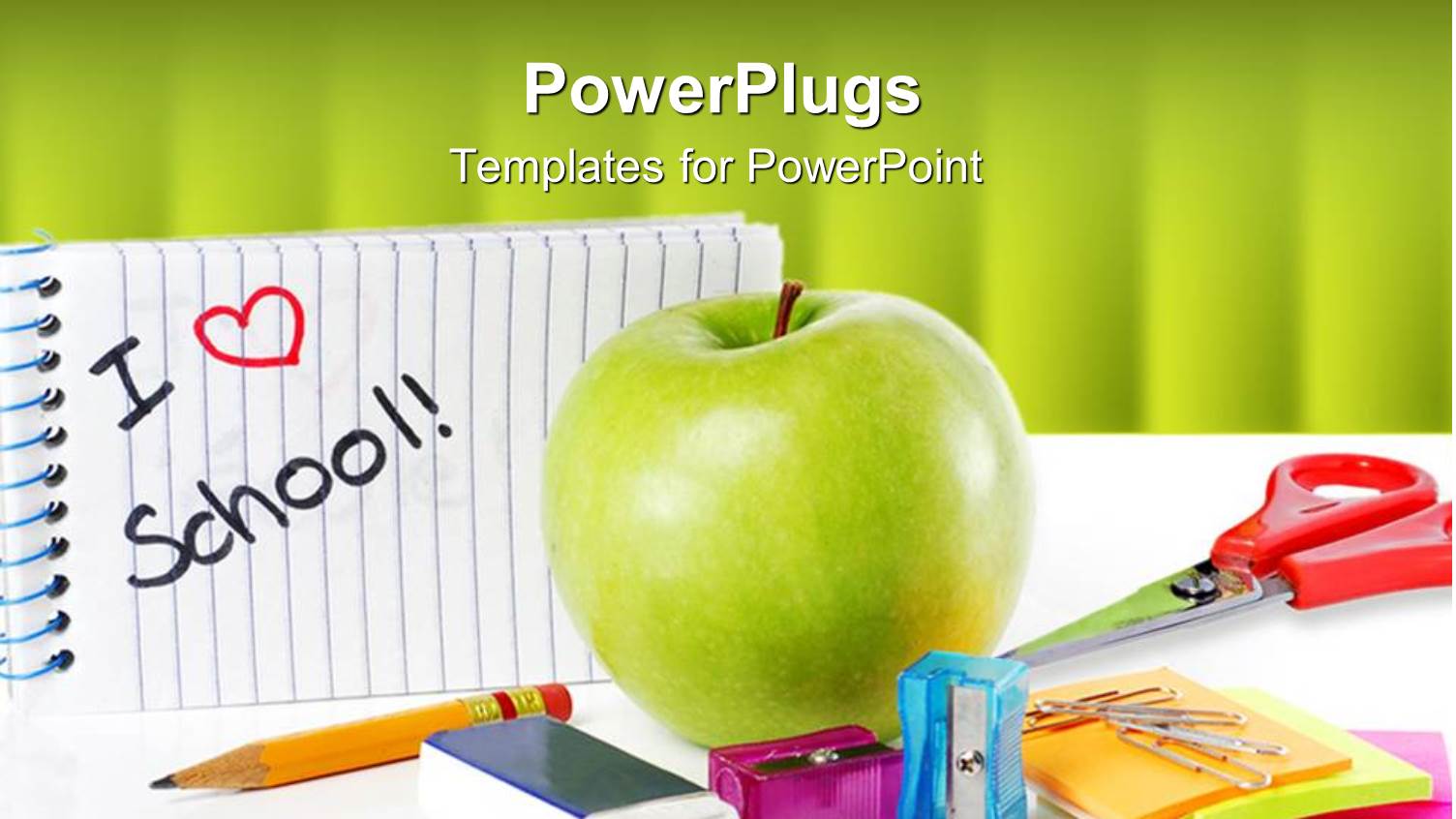 School Supplies with Apple and Message i Love School on Green Background