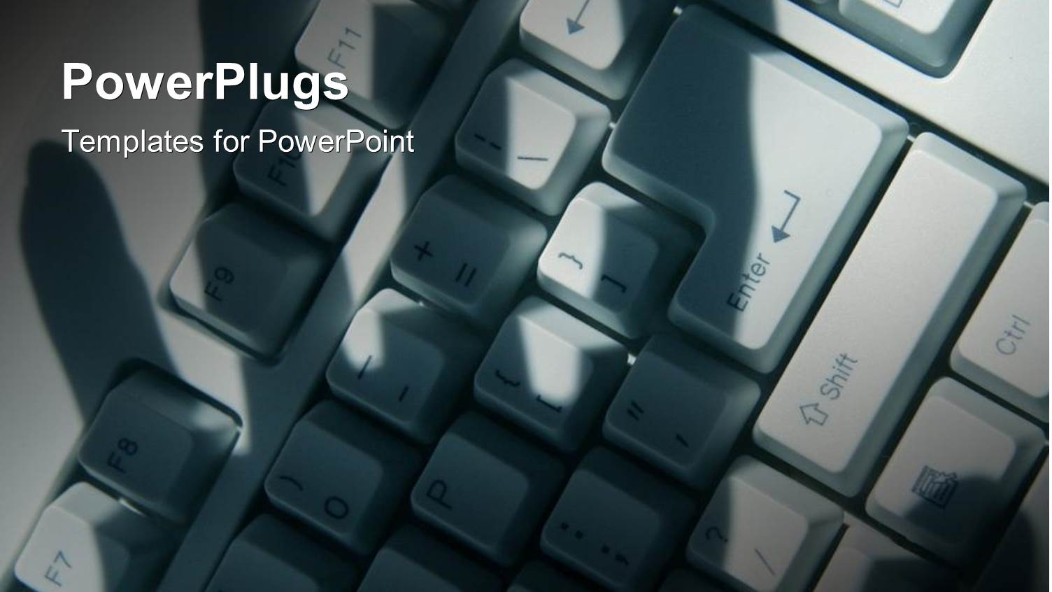 Shadow of Hand Over Computer Keyboard Hacking