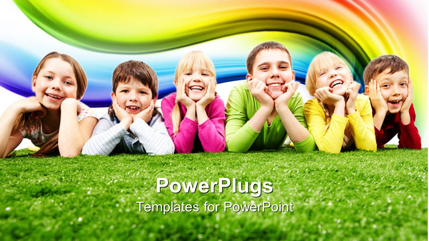 Six Happy Kids, Three Girls and Three Boys Lying on Green Grass Smiling Happy at the Camera with Rainbow in the