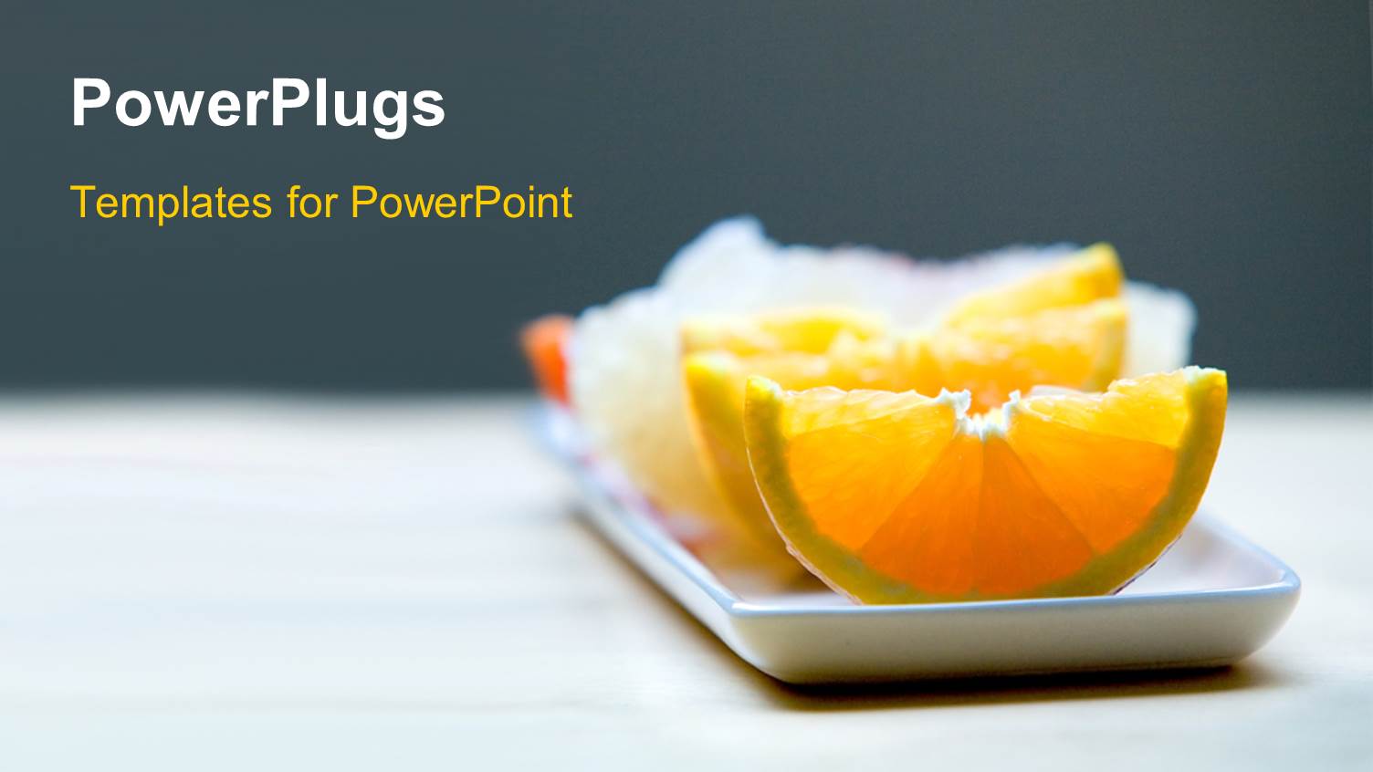 small White Rectangular Plate Bearing Slices of Orange and other Fruits