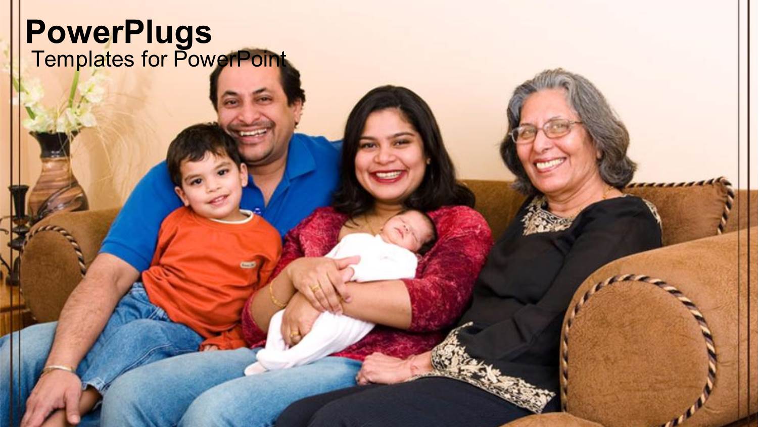 Three Adults and Two Children Smiling and Sitting