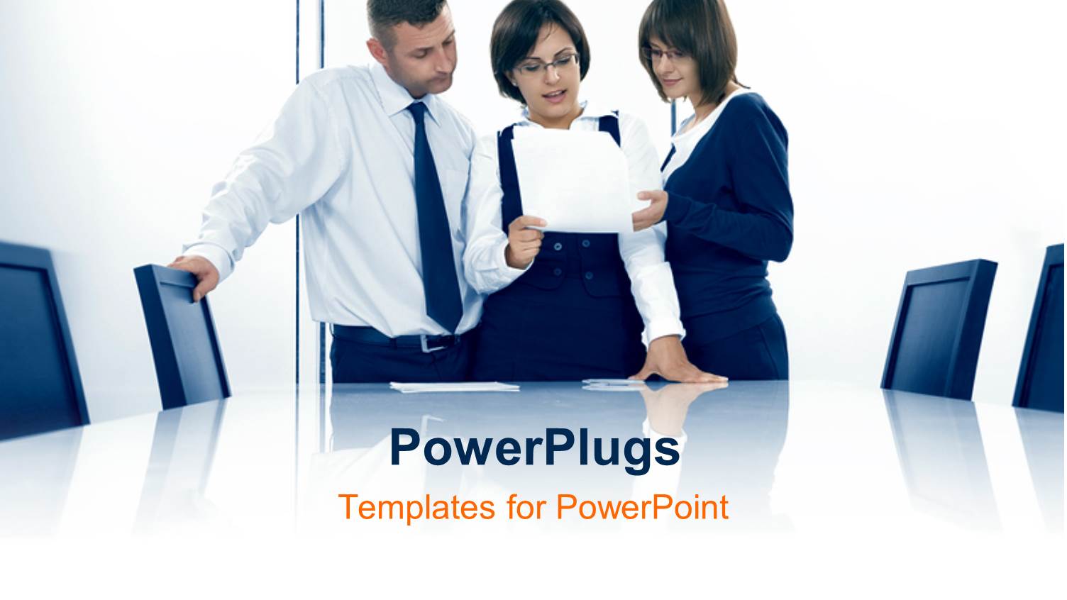 Three Business People Interacting Over Document in Conference Room  