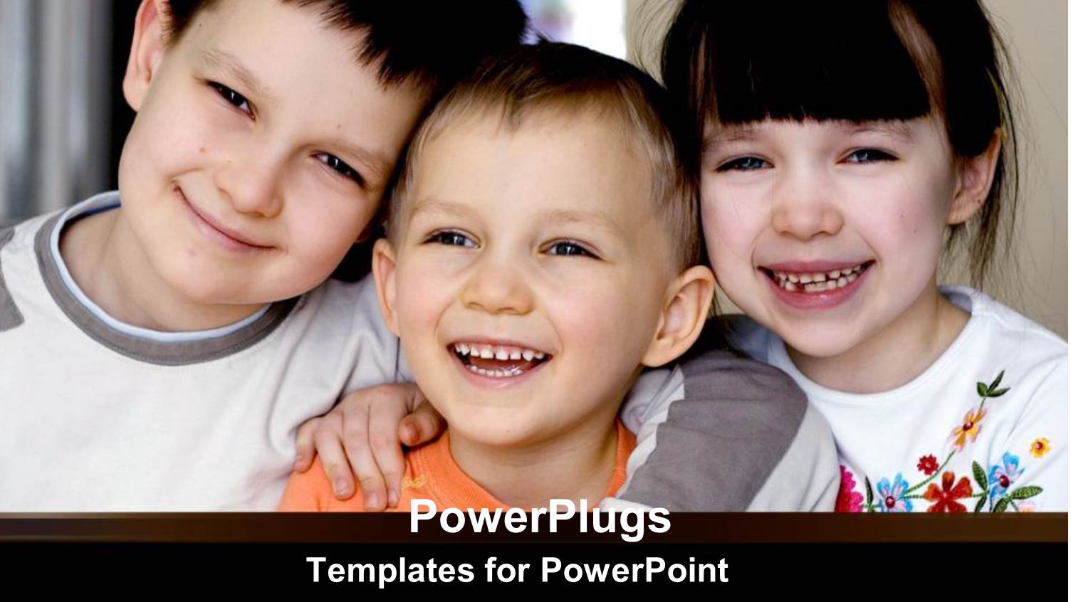 Three little Kids Smile as they Pose for Group Picture