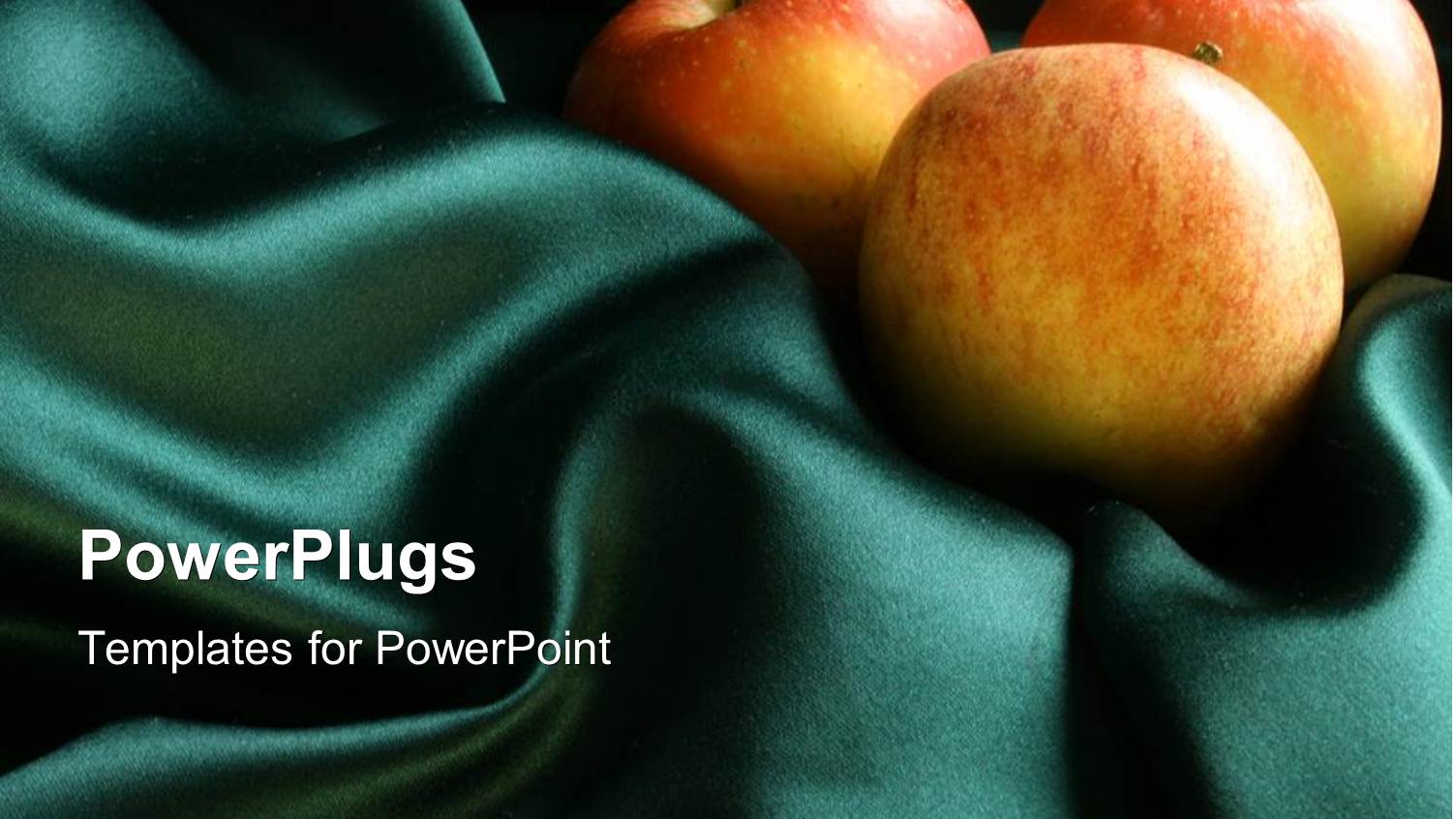 Three Red Apples on a Green Silk Cloth Material